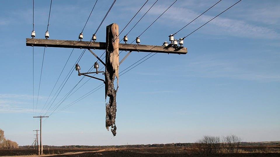 Electric-Pole-Hanging-After-a-Wild-Fire (1)